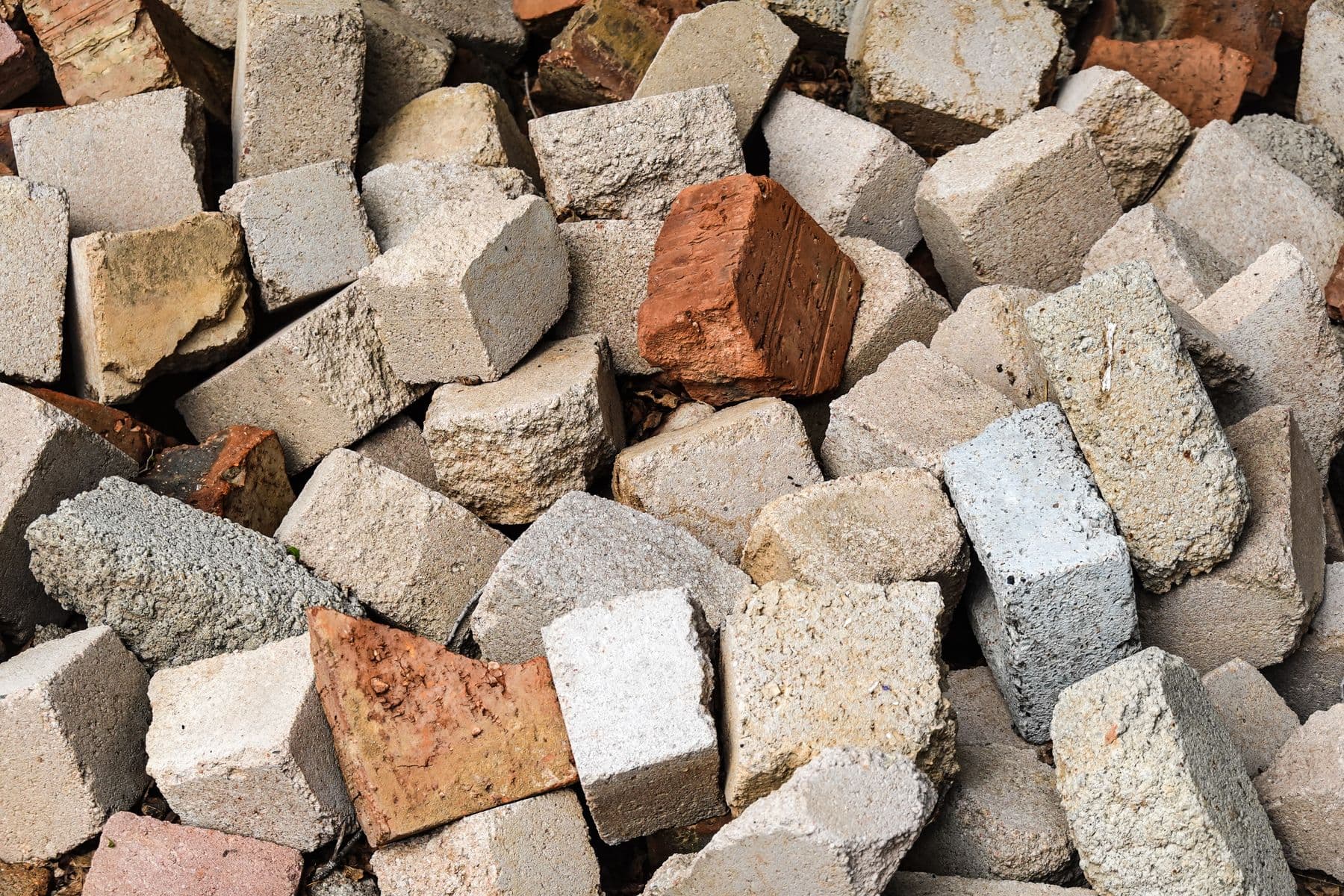 A close view of a pile of broken concrete blocks and bricks.